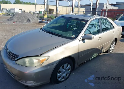 2003 Toyota Camry Le from USA, damaged, VIN 4T1BE32KX3U181028